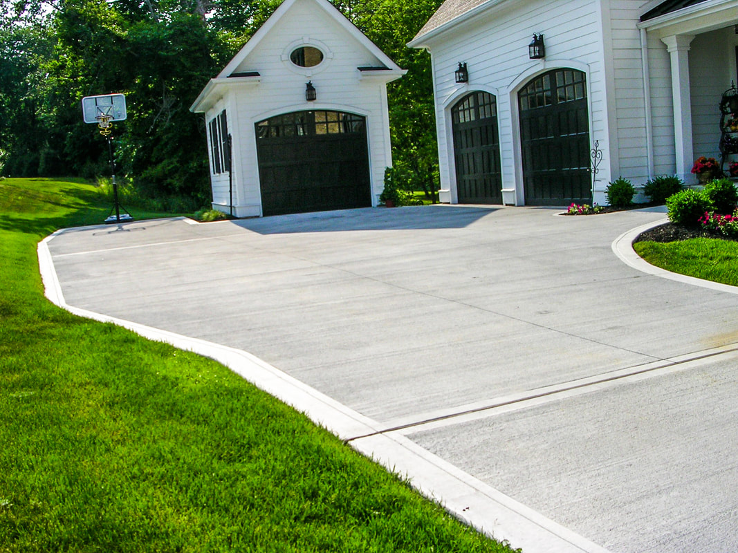 New Home Driveway Construction with a Concrete Cement Foundation by Builders for a Smooth Surface